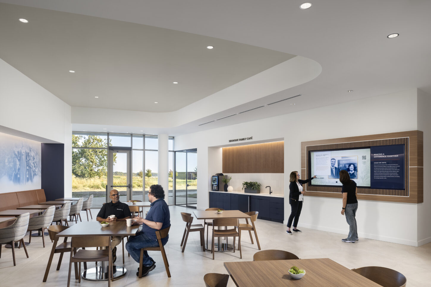 https://www.pmainc.com/wp-content/uploads/2023/08/Univ-of-Illinois-Foundation-HQ_Photo-Int-Cafe-1st-Fl-w-People_Photograph-by-Andrew-Rugge-Copyright-Perkins-Eastman-1450x967.jpg